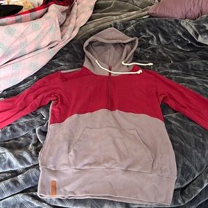 This a half zip hoodie that is maroon and gray. Never been worn tags still on.